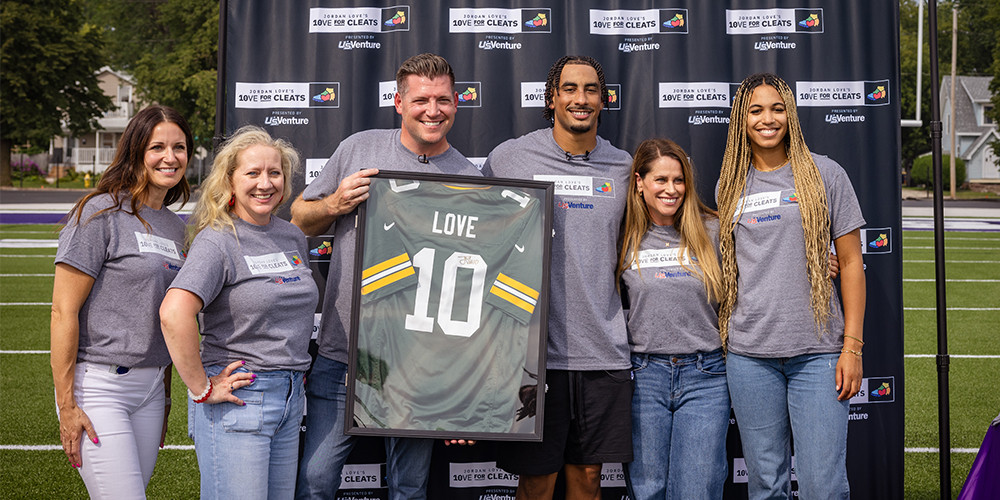 U.S. Venture team members with Jordan Love and his wife for 10ve For Cleats