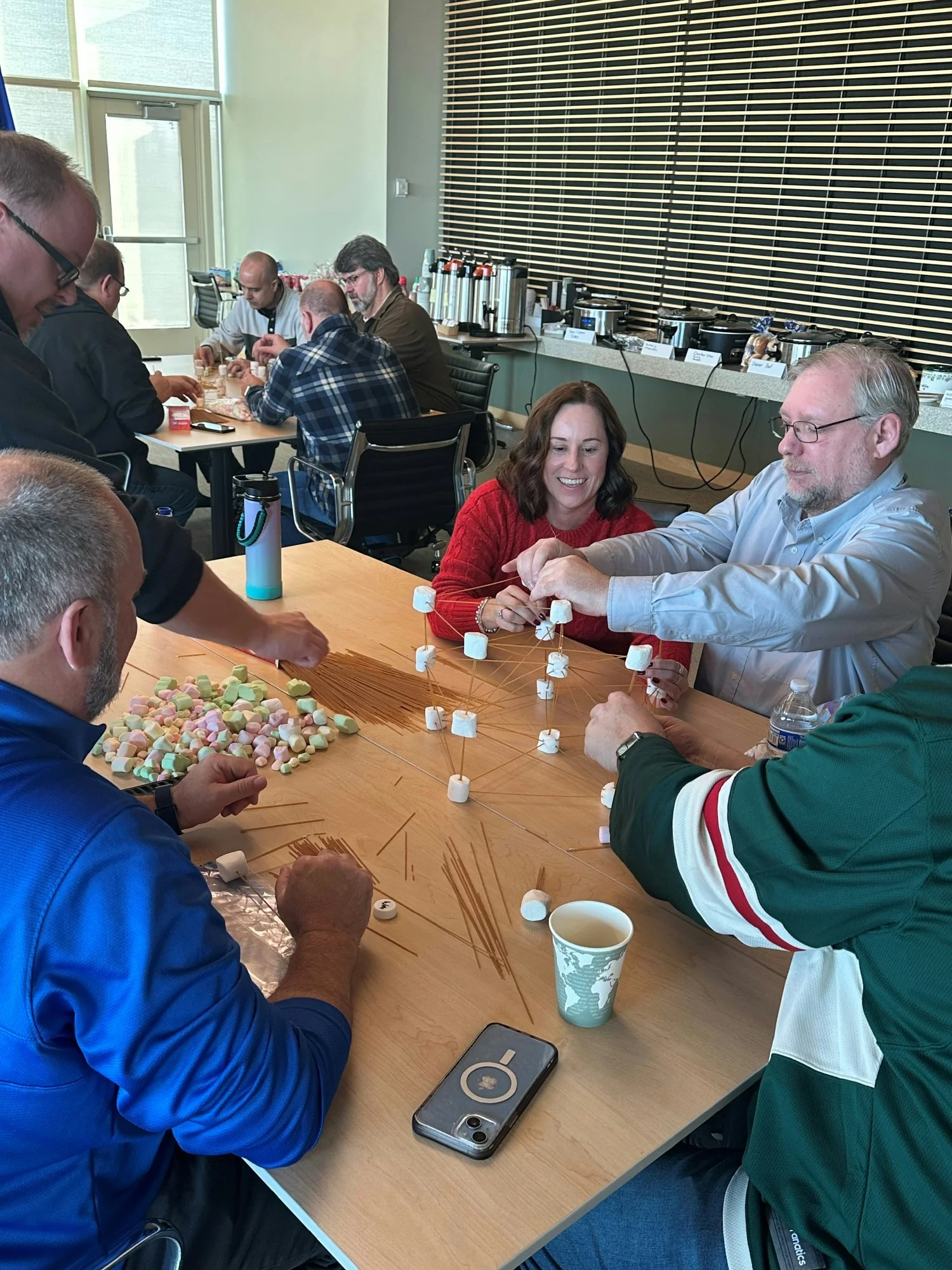 Employees enjoyed a team-building event where they built landmarks out of spaghetti and marshmallows.