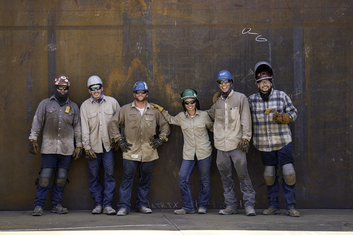 Matrix welders take a moment to pose for a group photo.