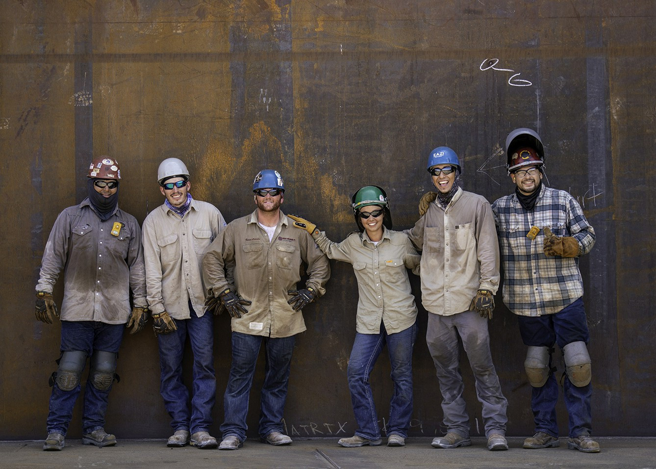 Matrix welders take a moment to pose for a group photo.