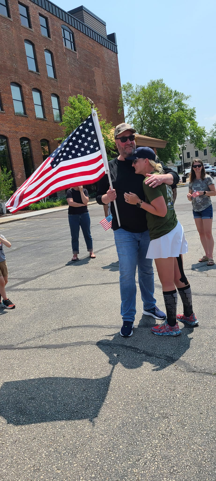 A welcoming hug after a Ruck March. Employees walk over 160 miles to raise funds for veteran's mental health initiatives