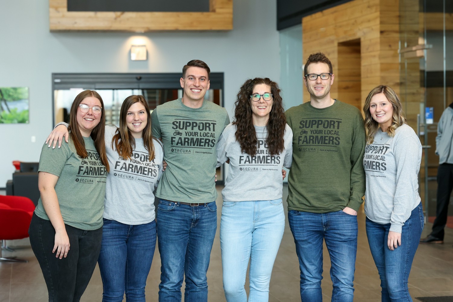 Farm Lines underwriters gather for a photo to show off their shirts supporting local farmers.