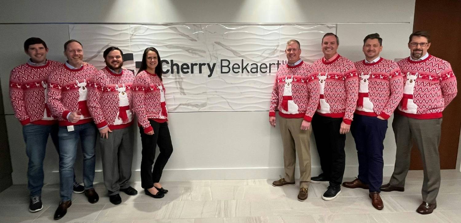 A few our colleagues in our Charlotte office and wearing some holiday cheer