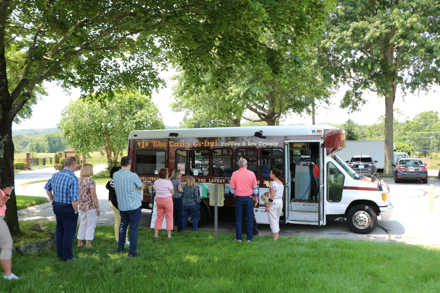Employees enjoy a visit from a food truck