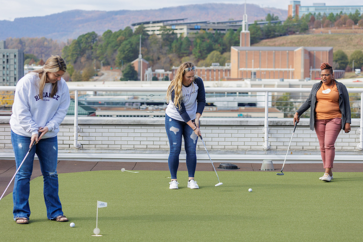 Team bonding on our rooftop putting green.