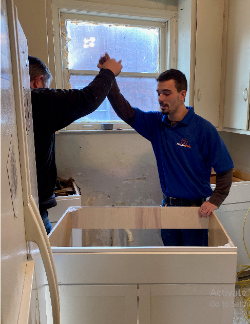 2019 HandyPro Give Back Day. HandyPro Craftsmen Patrick K. and Zane P. celebrating  a successful job well done.