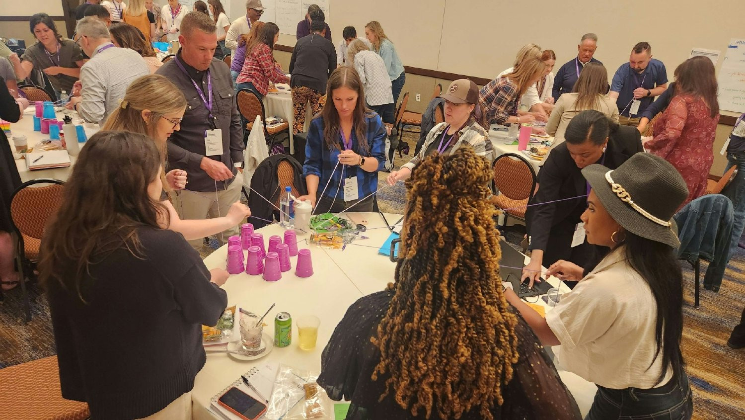Team members putting our Earn Trust Daily value into action during a team-building exercise.