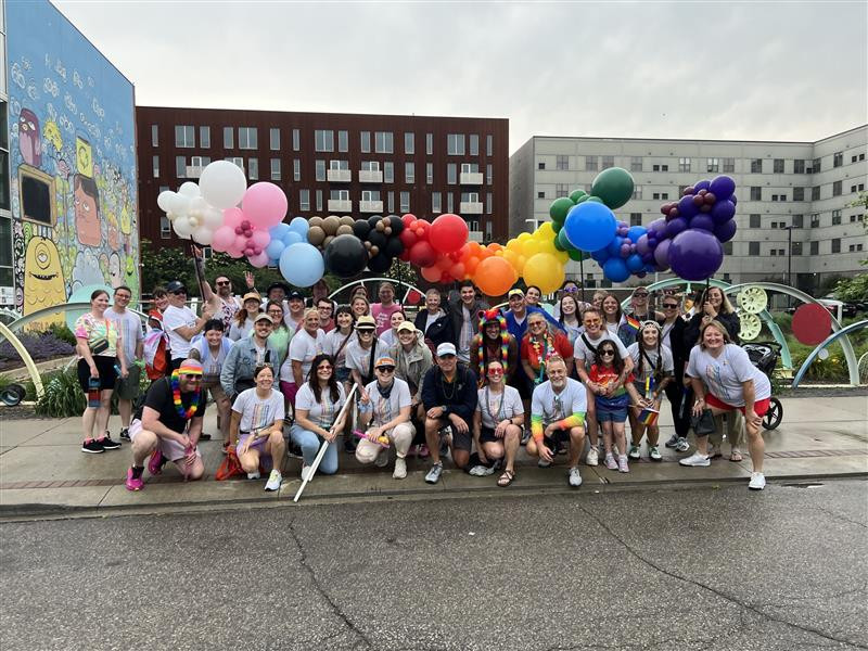Team members walking in the Capital City Pride parade in Des Moines, Iowa, sponsored by our LGBTQ+You affinity group.
