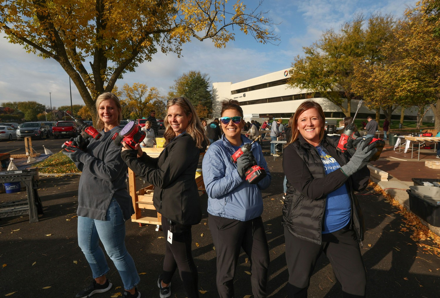 Team members building beds for a local non-profit.