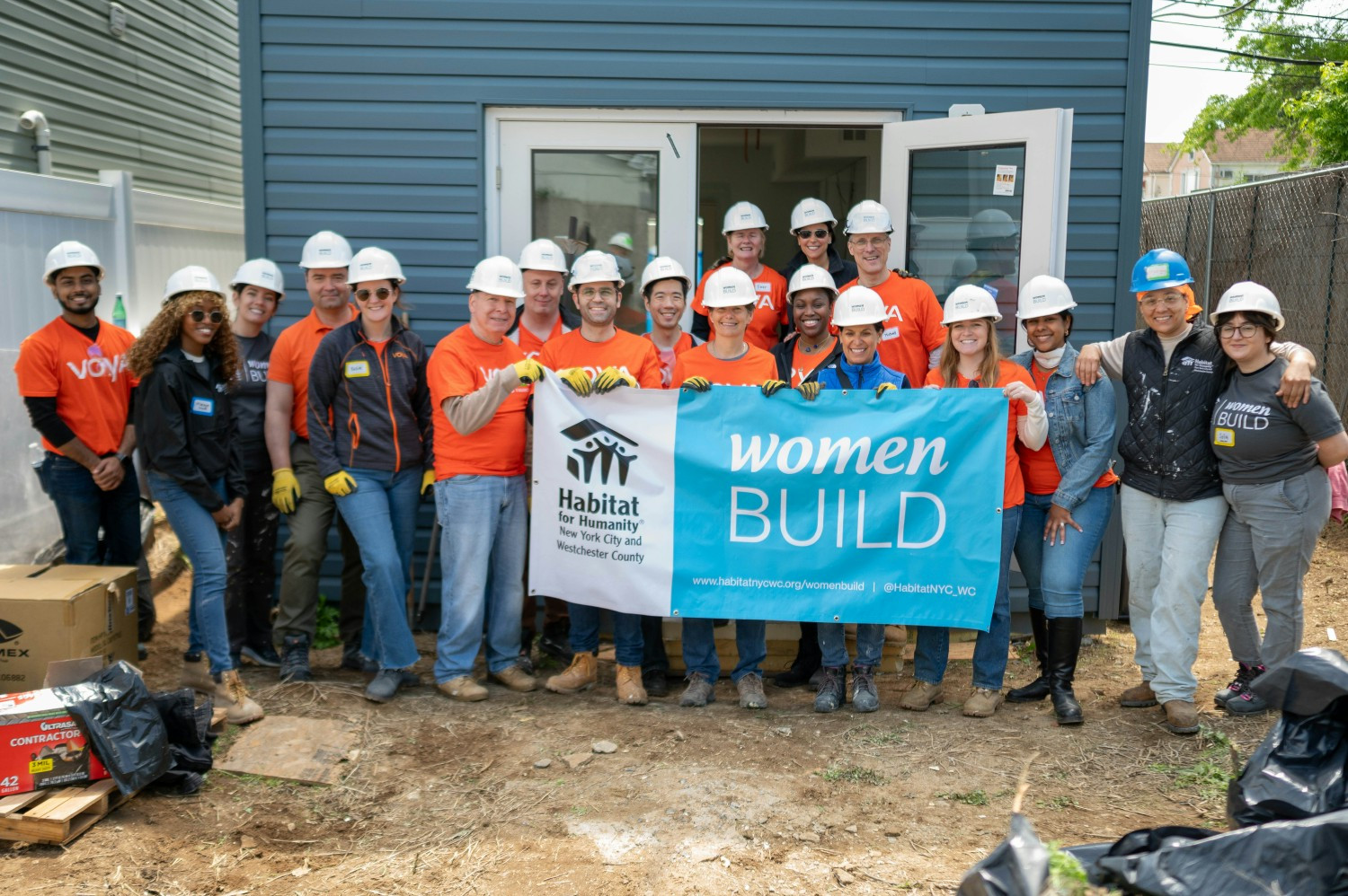 Employees volunteering for Habitat for Humanity's Women Build program.