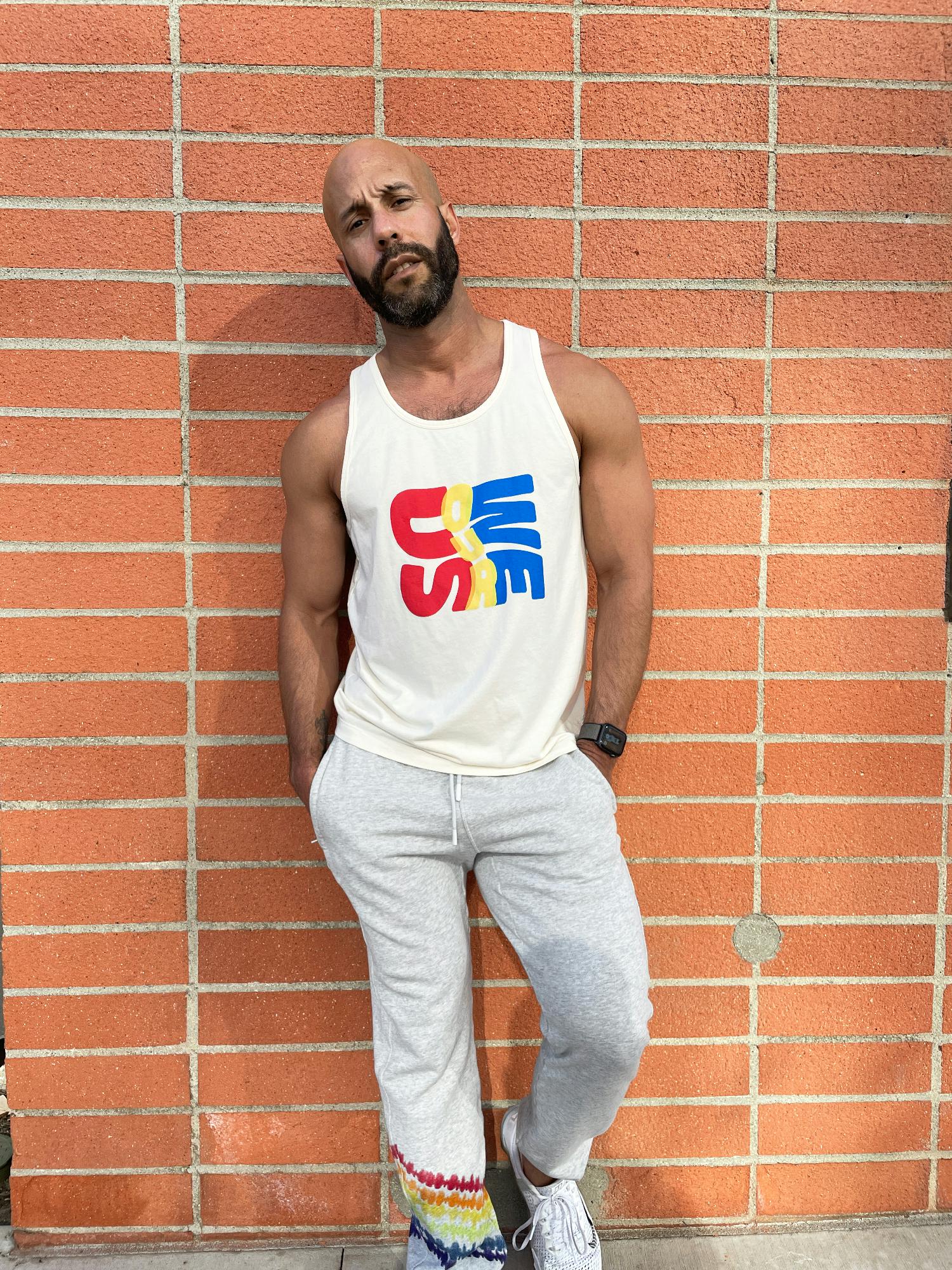 Fabletics employee, Luis Velazquez, modeling this years Pride collection.
