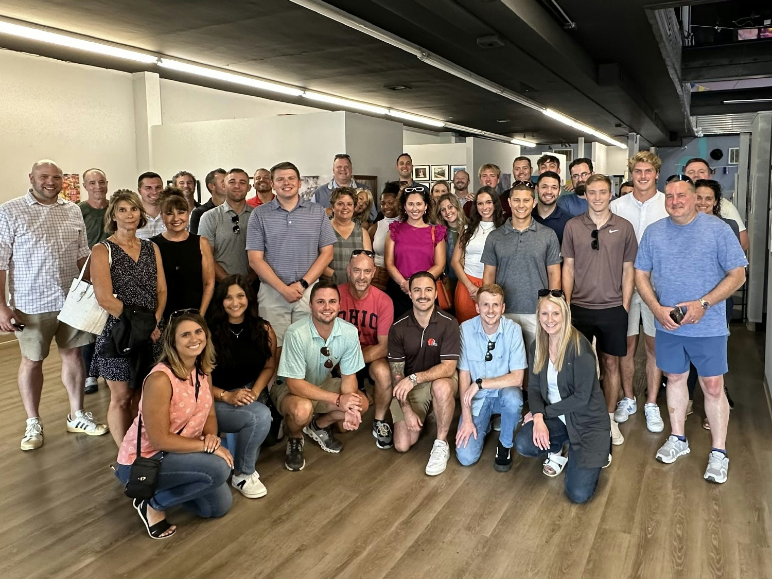 The team posing for a photo during a First Friday team building activity.