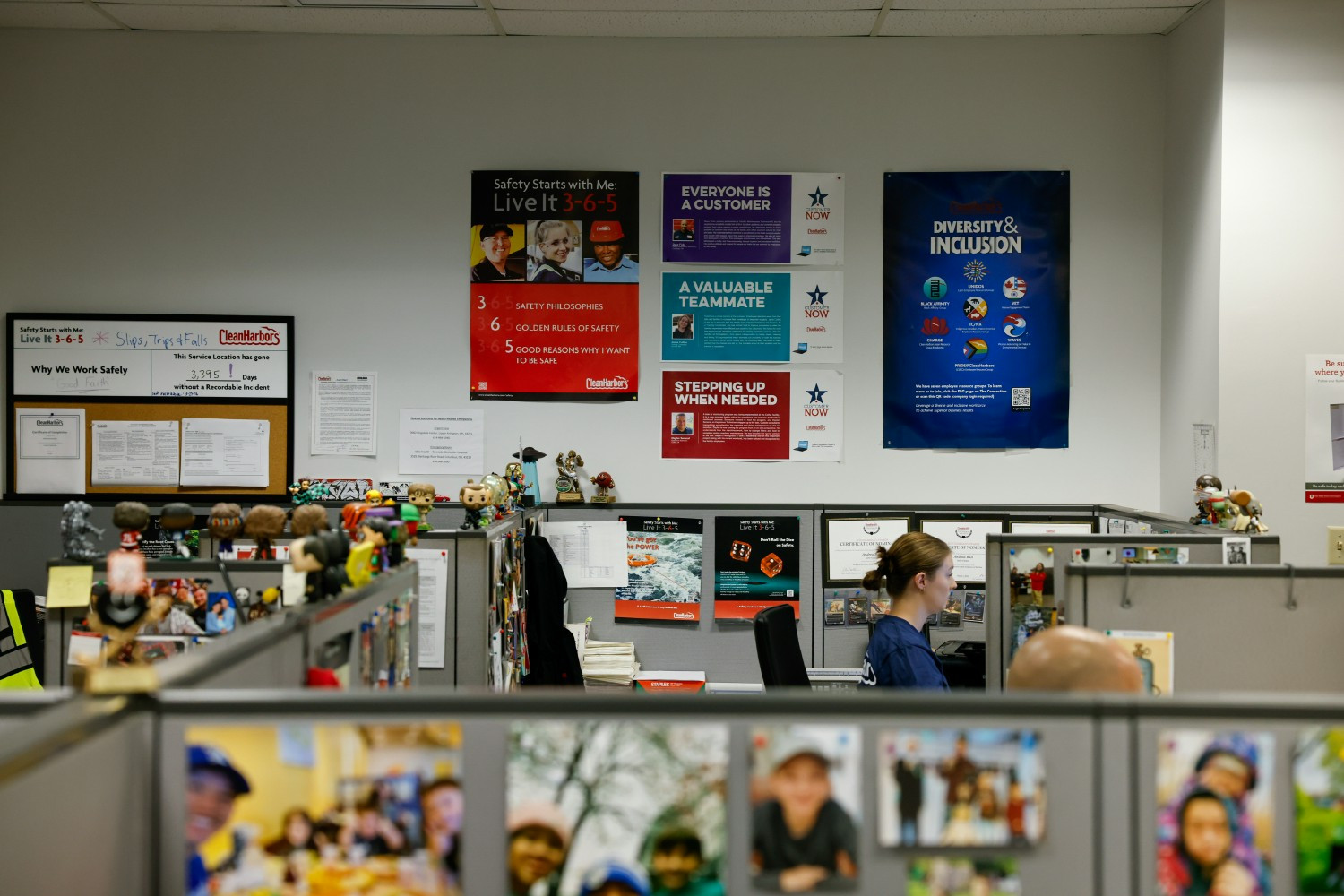 Office work with safety posters displayed