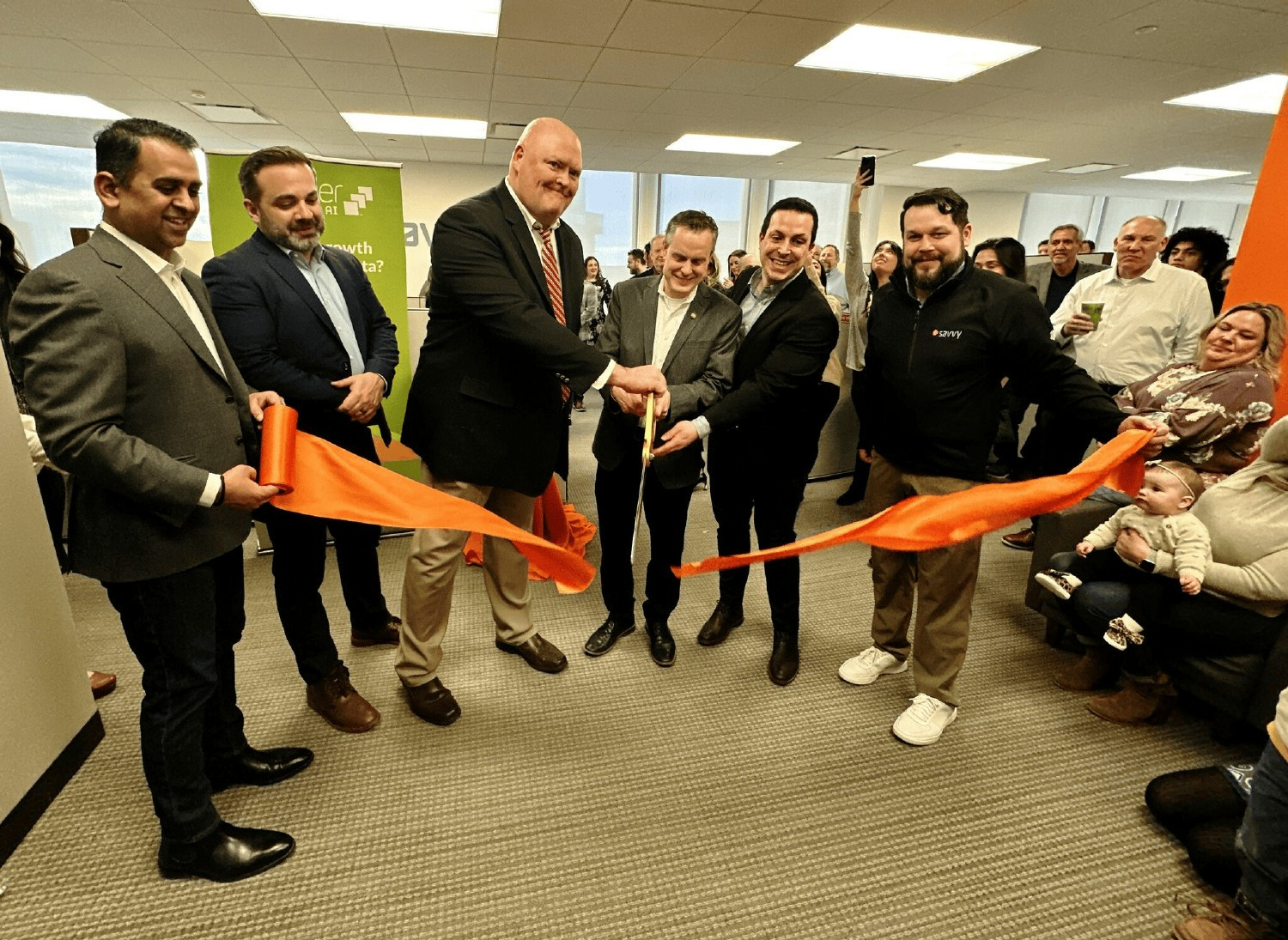 Ribbon cutting ceremony with the Village President of Oak Brook (From left to right, our CTO, COO, CRO, Pres, CFO, CHRO)