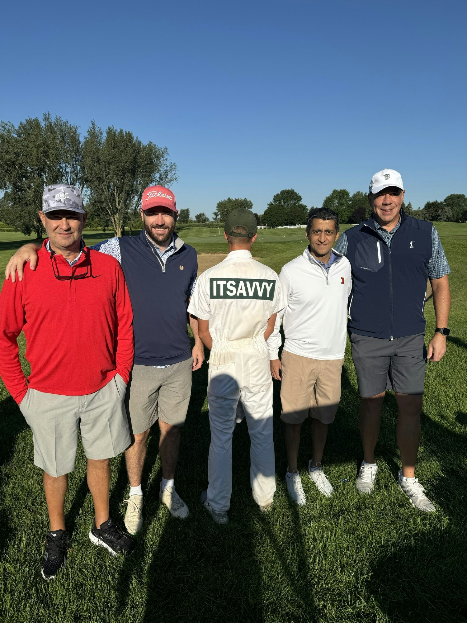 Our CEO, Munu (second from the right), pictured at the ITsavvy Open 2024 with clients