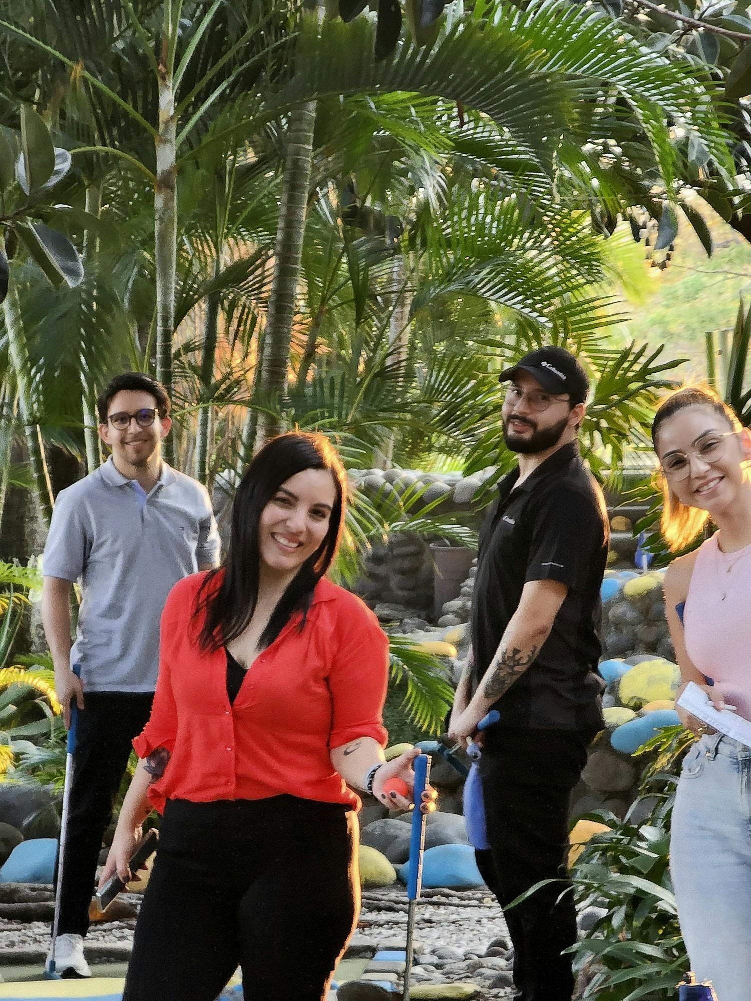 Team members in Costa Rica enjoy a round of golf after office
