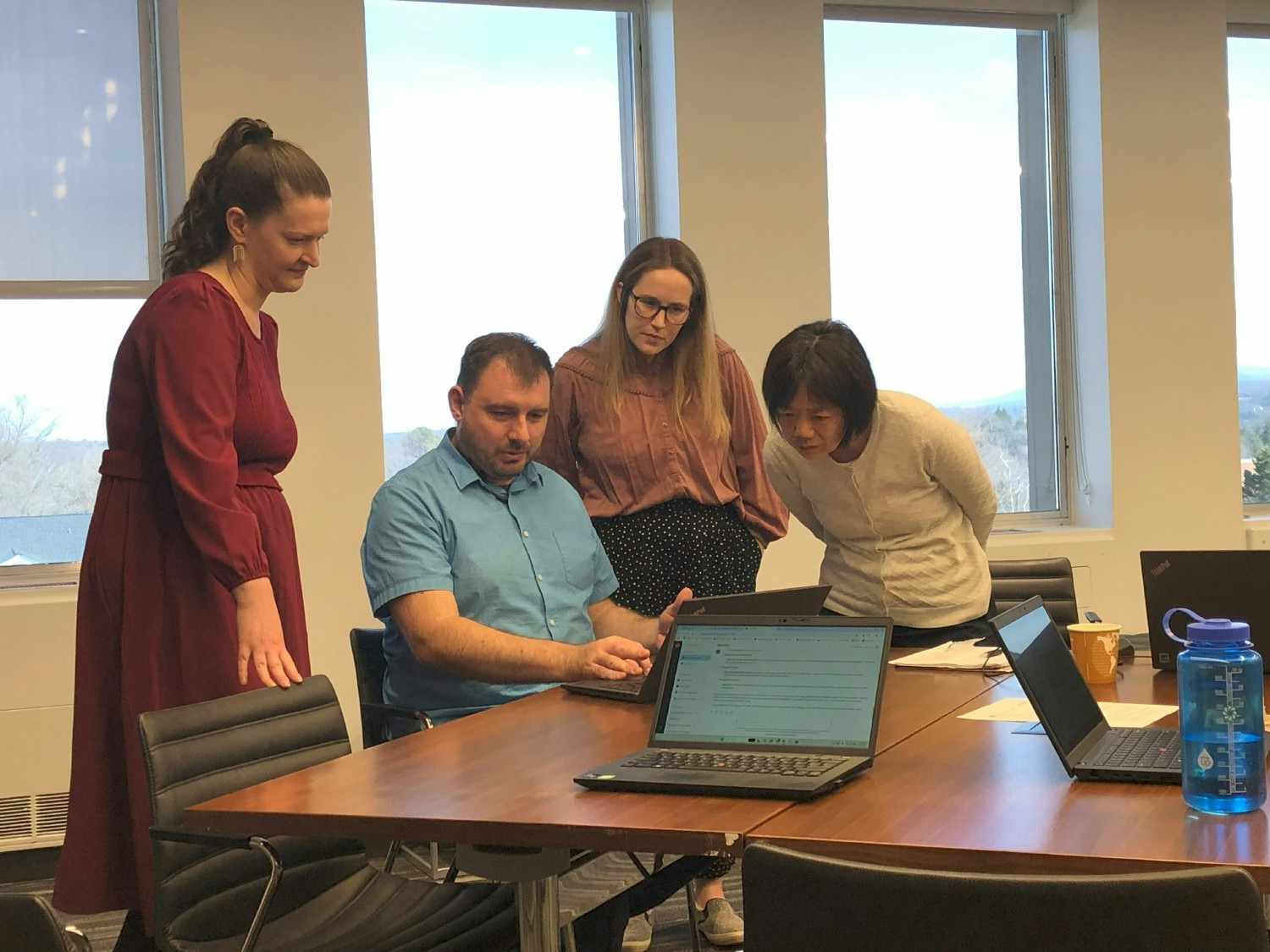 Colleagues in Charlottesville, VA share AI solutions in a hands-on workshop, hosted by the EssentialTECH VA chapter