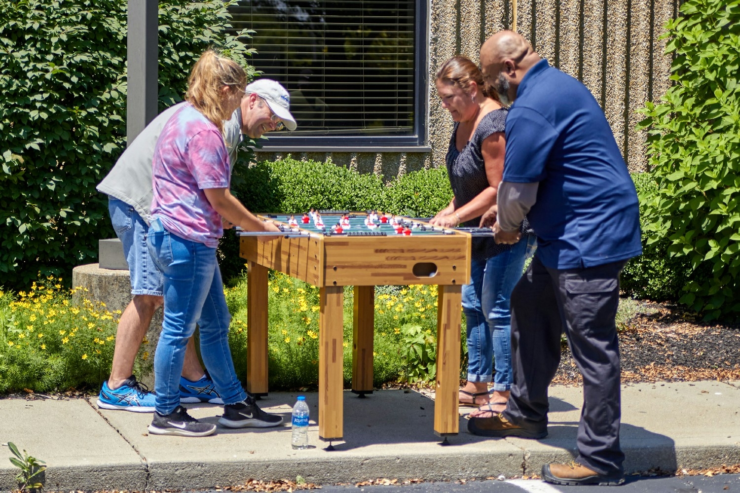 Summer Fun! Enjoying the nice weather with a cookout and summer games for a retirement celebration.