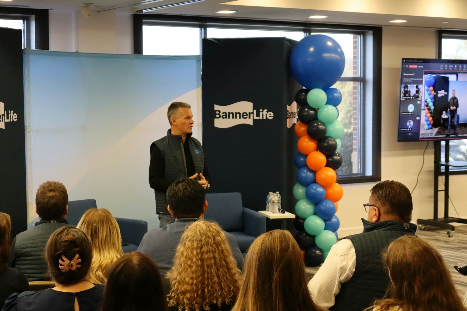 Our President and CEO, Mark Holweger, speaking during a quarterly all staff huddle, projected virtually.