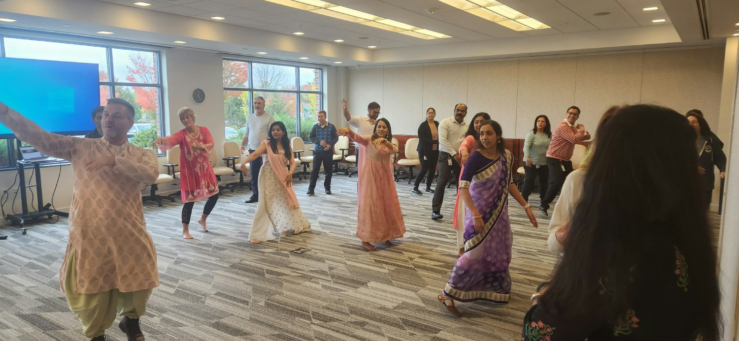 Employees attend a Diwali dance event during our annual charity campaign supporting local charities.