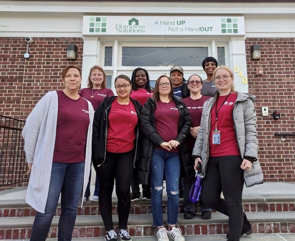 Affinity employees pose after a day of volunteering for a local non-profit organization