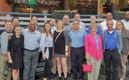 Glory New Employee Orientation program participants networking at dinner following a day of training