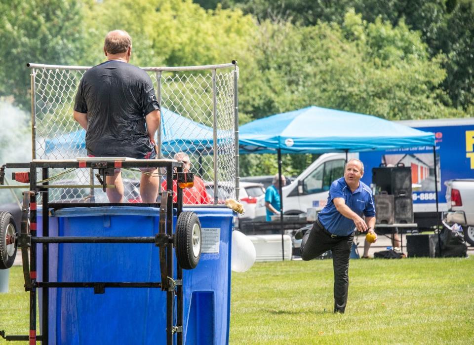 Chris Reagan, President of Glory Americas participating in the Dunk Tank during our Annual Summer Picnic event, raising $5000 to support the local Humane Society in Watertown, Wisconsin