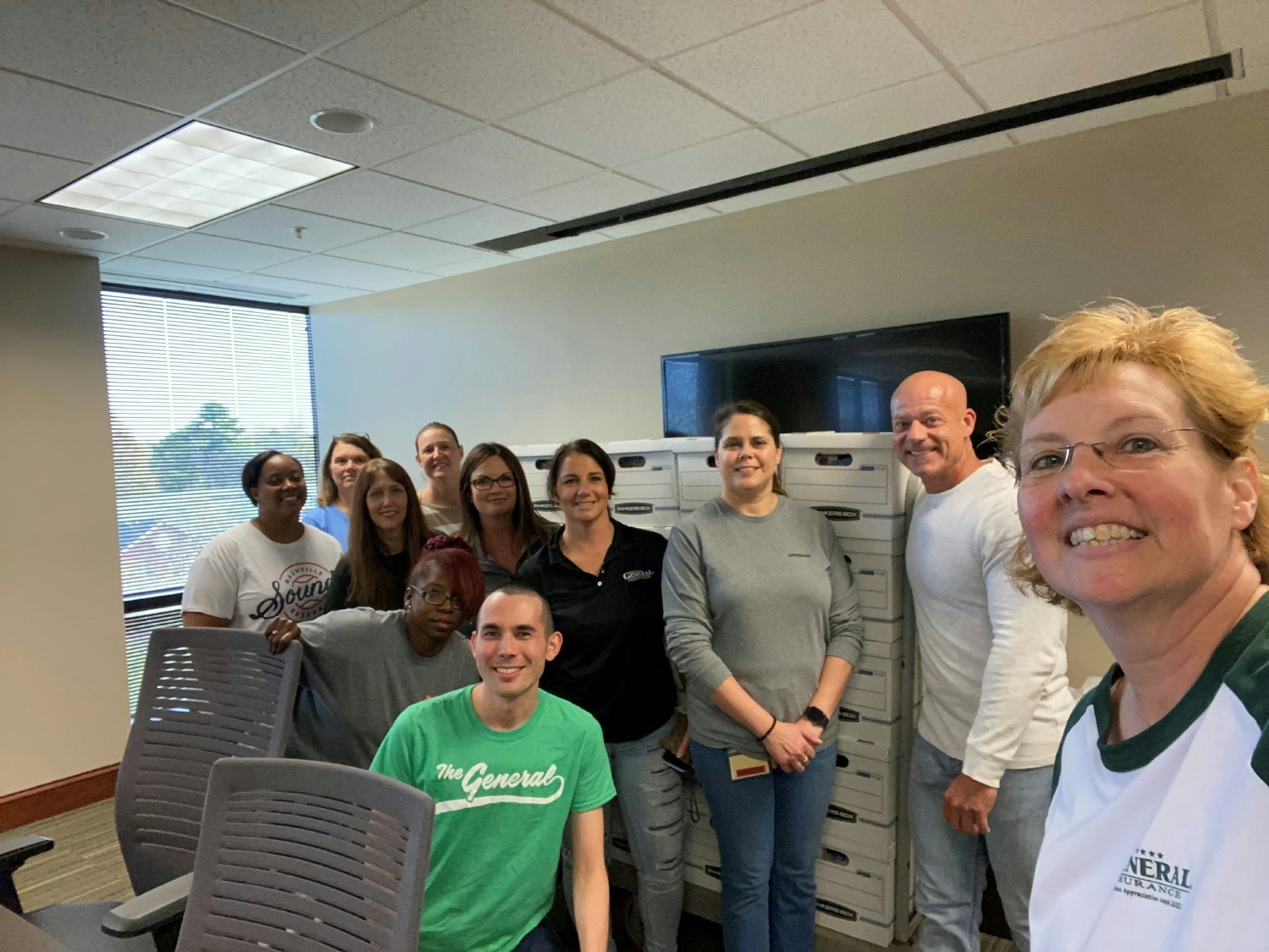 Employees in Nashville use their paid volunteer time to build meal boxes for United Way.