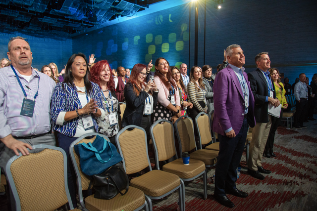 President, Adam Bruckman, and team members enjoy a memorable speaker presentation.