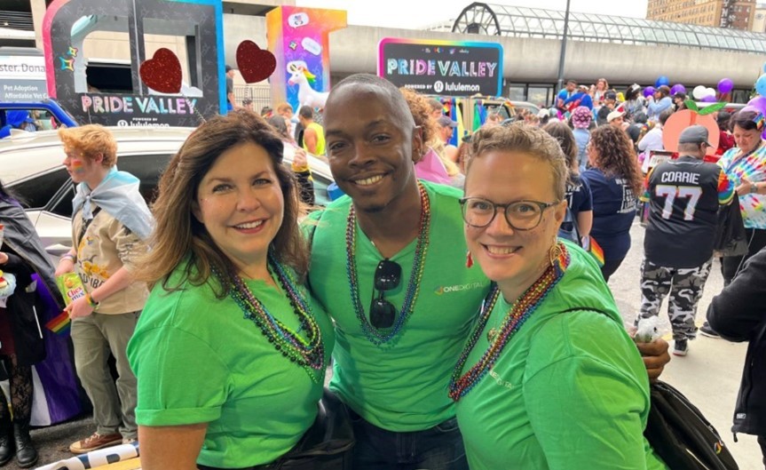 Chief People Officer, Elizabeth Chrane, and OneDigital leaders show support in the Atlanta Pride Parade.