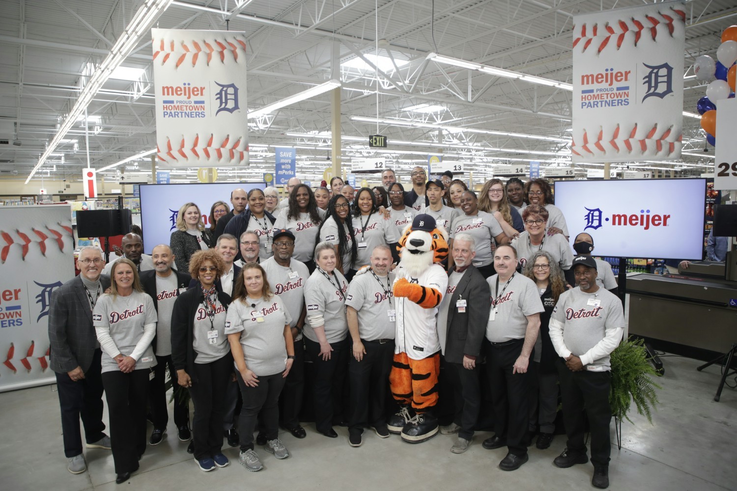 Team members at a Meijer store in Detroit celebrate Meijer’s historic partnership as the Detroit Tigers jersey sponsor.
