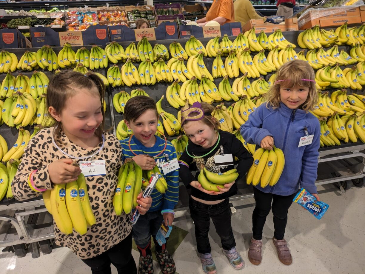 Team members' kids participate in a quality control activity during Take Your Child to Work Day 2024.