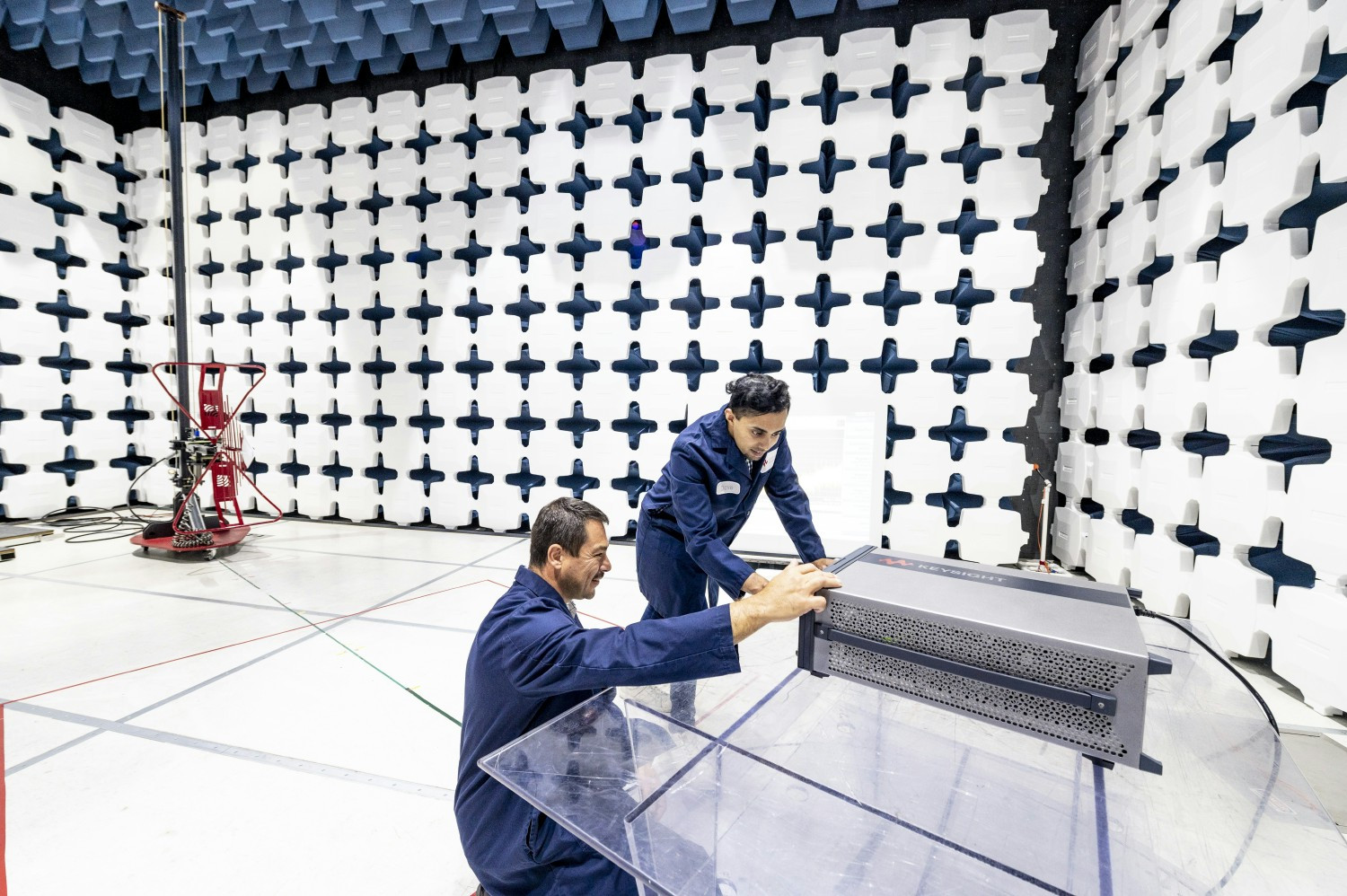 Keysight technologists in the EMC chamber.