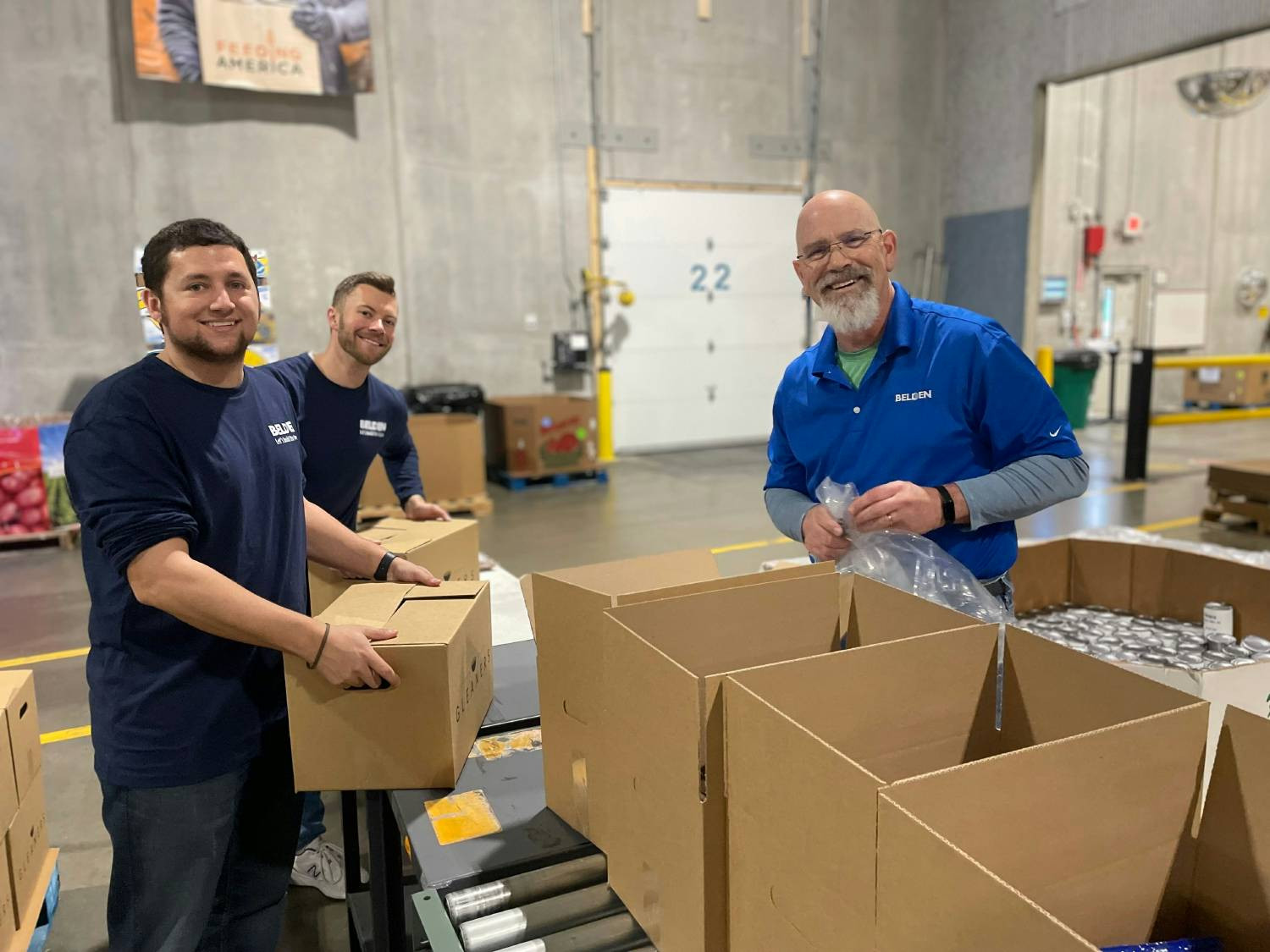 Indianapolis volunteers utilize Belden’s Connect with Community program to pack meals for those in need.