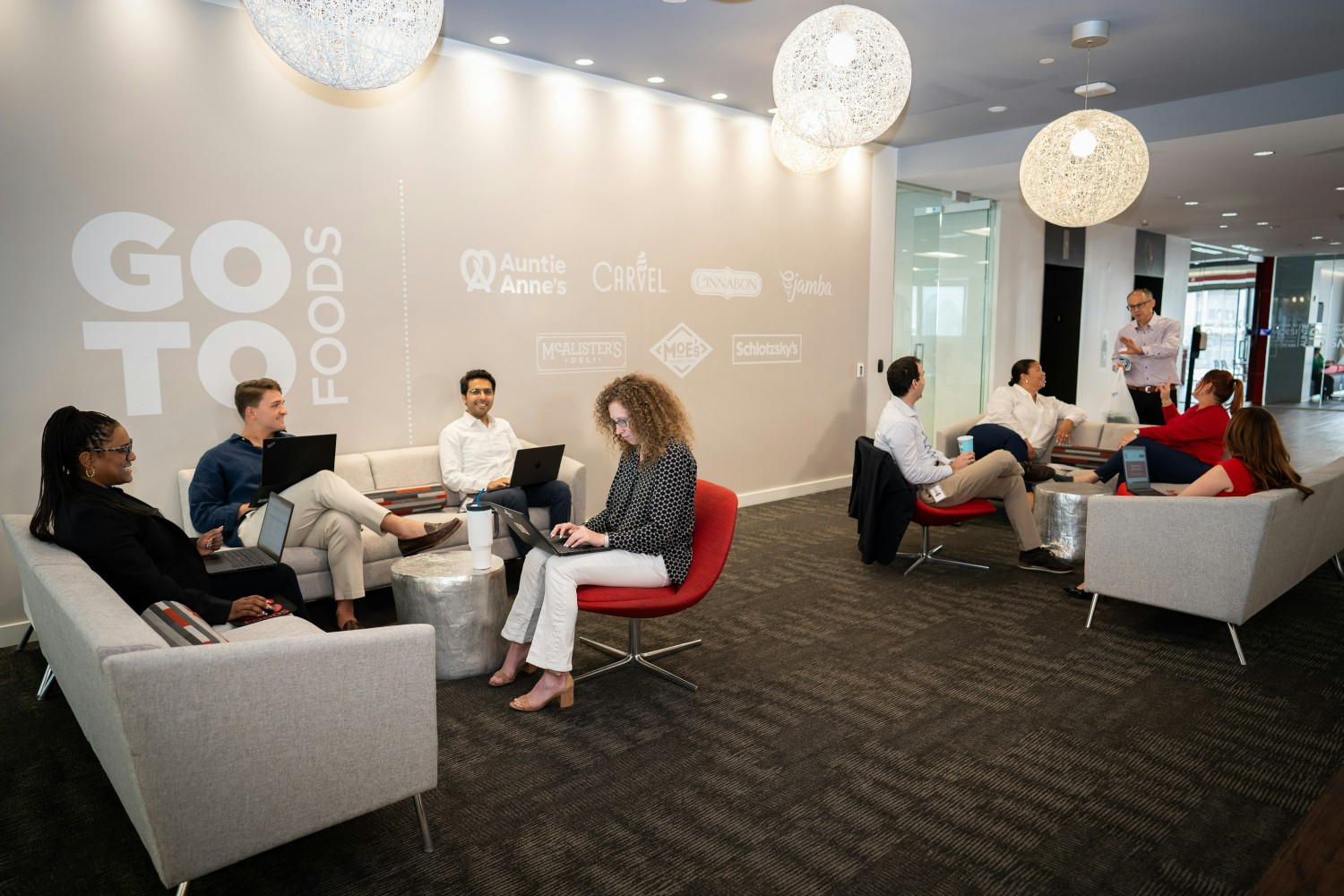 GoTo Foods employees often gather in the third-floor lobby for ac chat with CEO Jim Holthouser. 