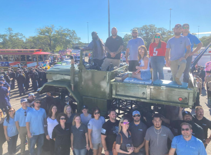 Uniti's Proud 2 Serve Diversity and Inclusion Group (DIG) honoring and serving in a local Veteran's Day parade.