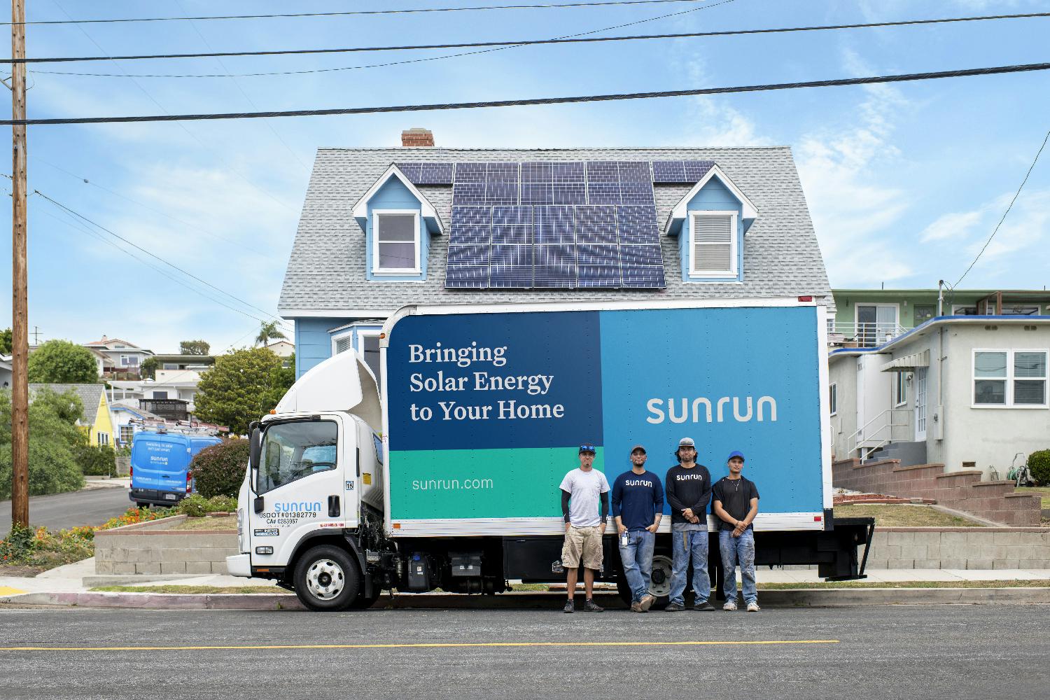 Sunrun Installation crew admires their work on a completed installation.