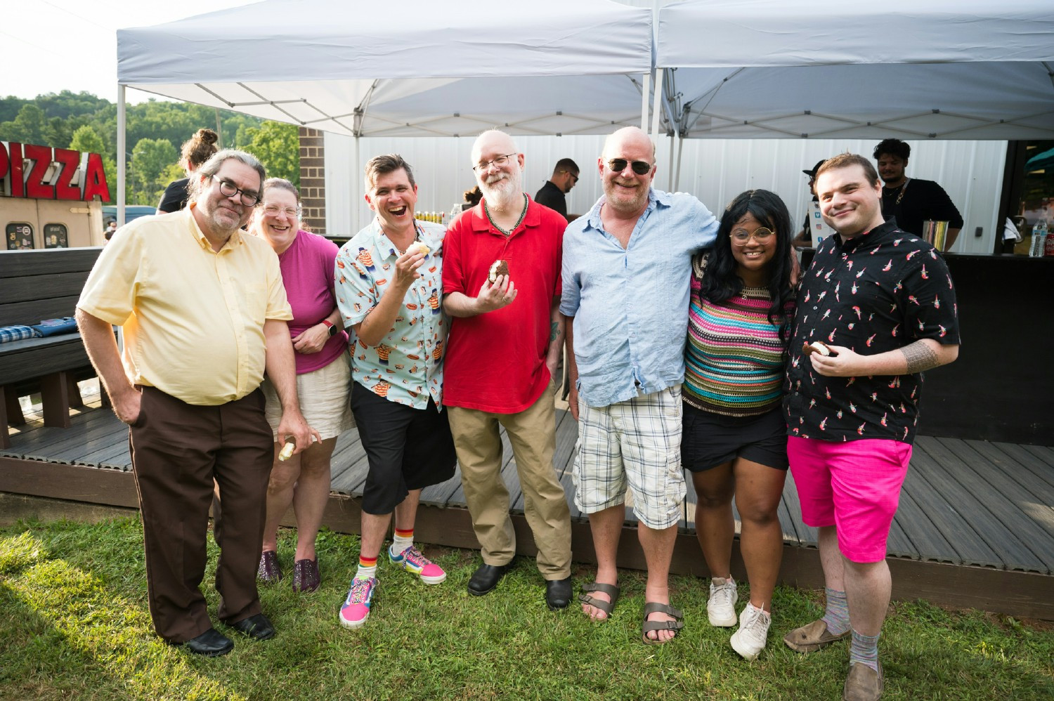 Employees enjoy our family-friendly Summer Bash with food trucks, raffles, inflatables, and more. By Mozingo Photography