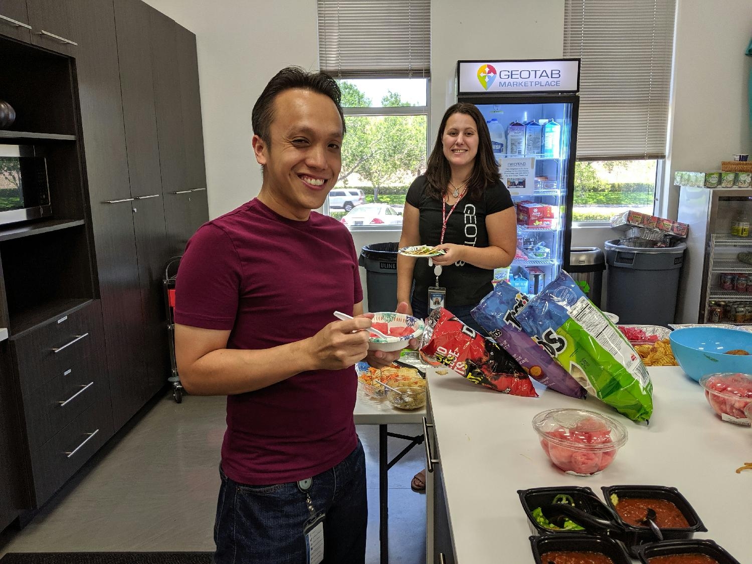 Geotab staff enjoying some snacks at the office