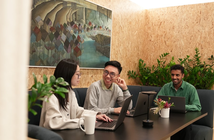 Team members enjoying our coworking space in the kitchen