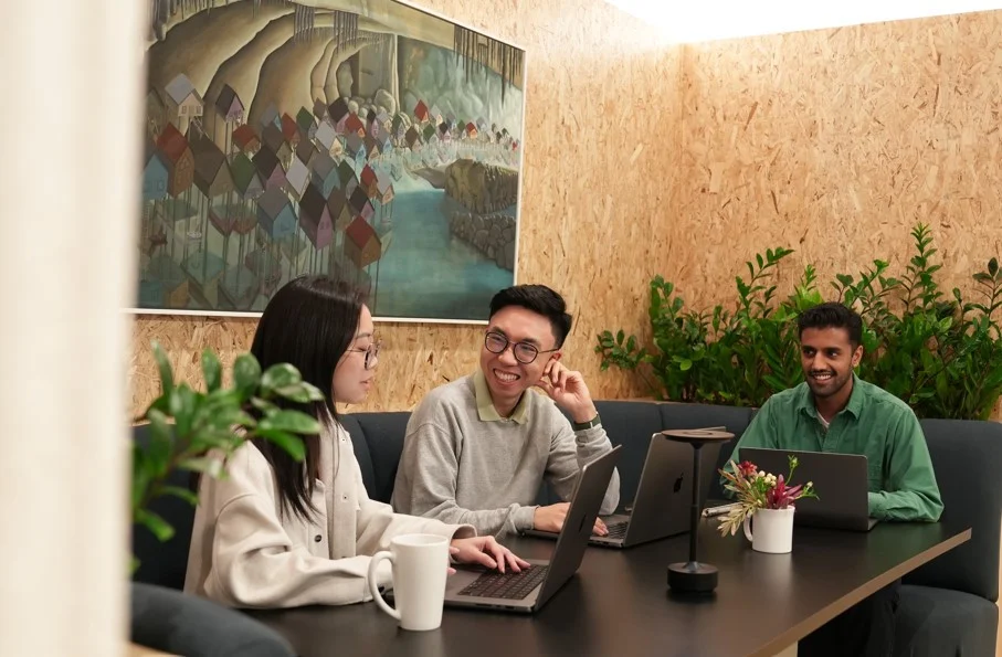 Team members enjoying our coworking space in the kitchen