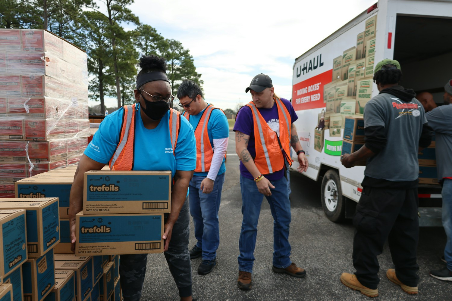 Insperity employees volunteered to help move Girl Scout cookies into a truck for delivery for sales later on.