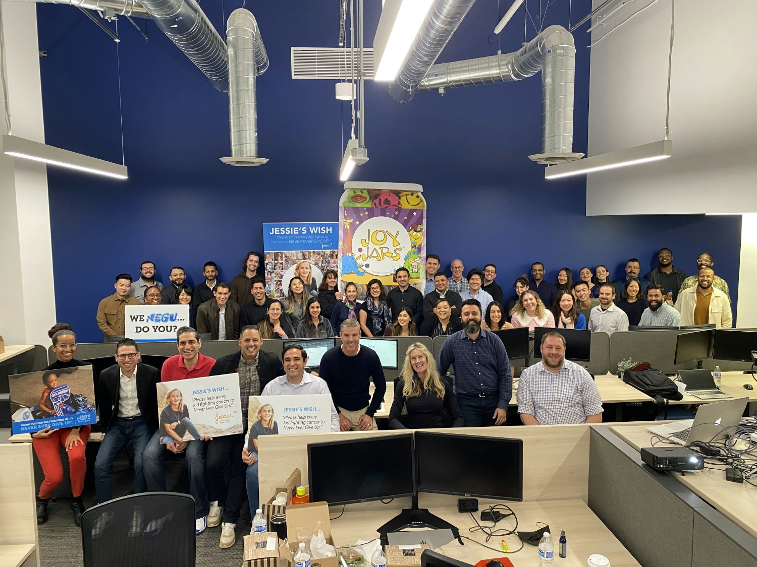 CNM professionals assembled to build Joy Jars for children battling cancer with the NEGU Foundation