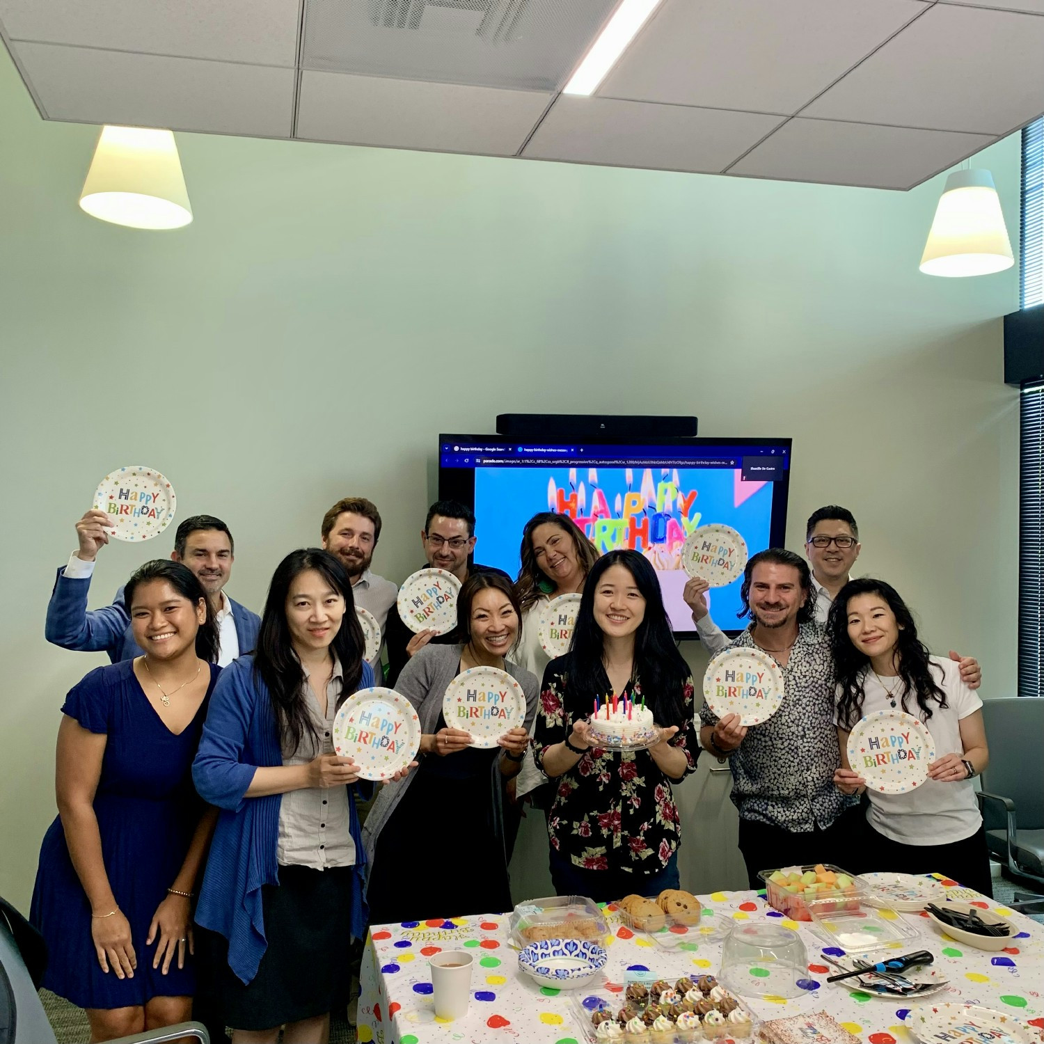 IT professionals celebrating a team birthday in the Woodland Hills office
