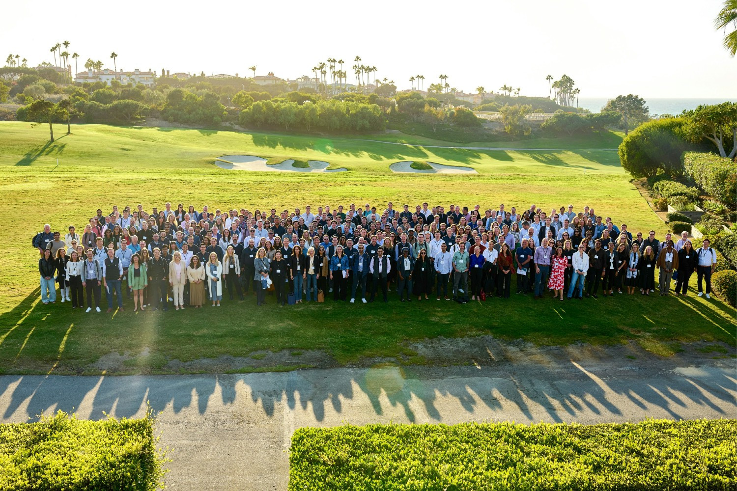 A group photo of the Alpine team and community at our annual Growth Summit event in 2022.