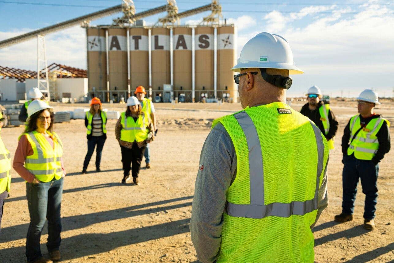 Atlas Energy Solutions employees visit one of their plants in West Texas