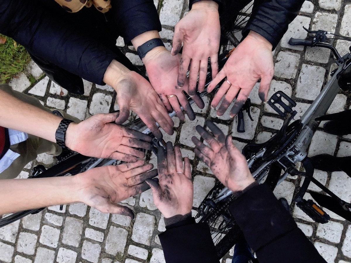 Nothing says teamwork like a roadside bicycle repair, in Nantes, France, on The Thomas Collective’s annual Trend Trip.