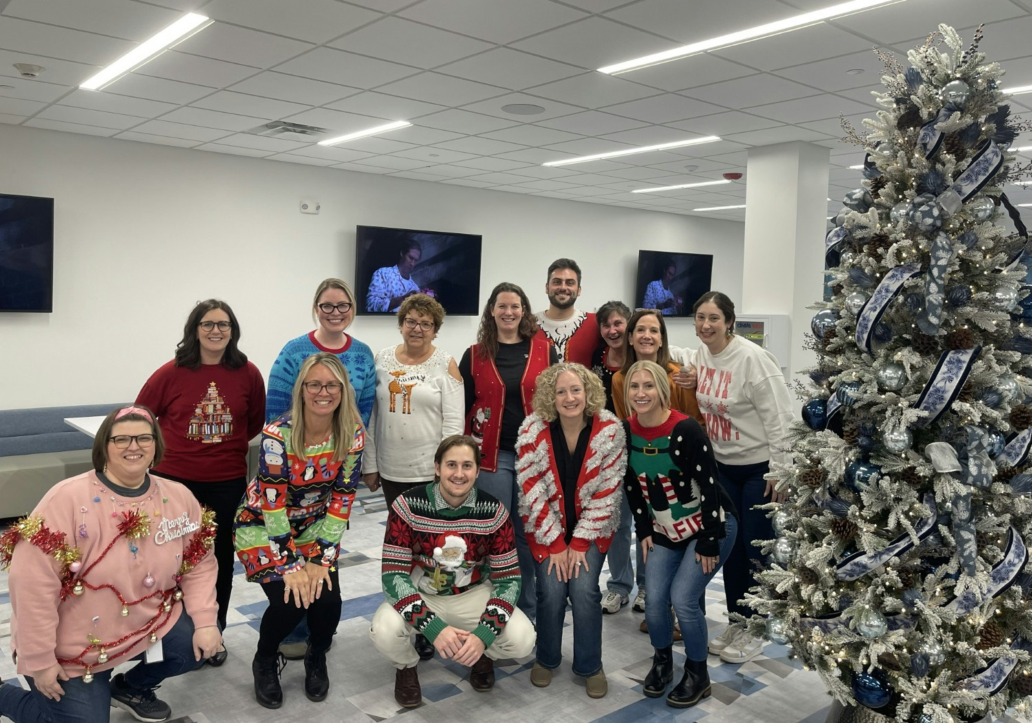 Celebrating the holidays with festive Ugly Sweaters at the office