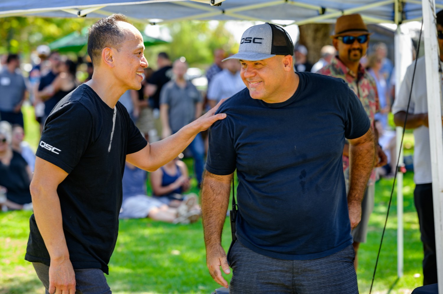 QSC's CEO connecting with employees at our company picnic.
