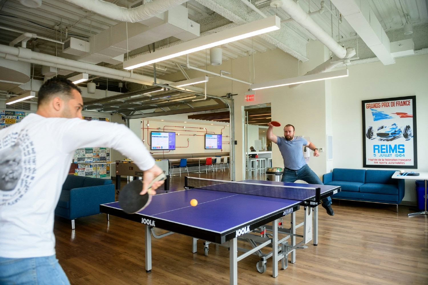 Gurus take a break in the CarGurus game room